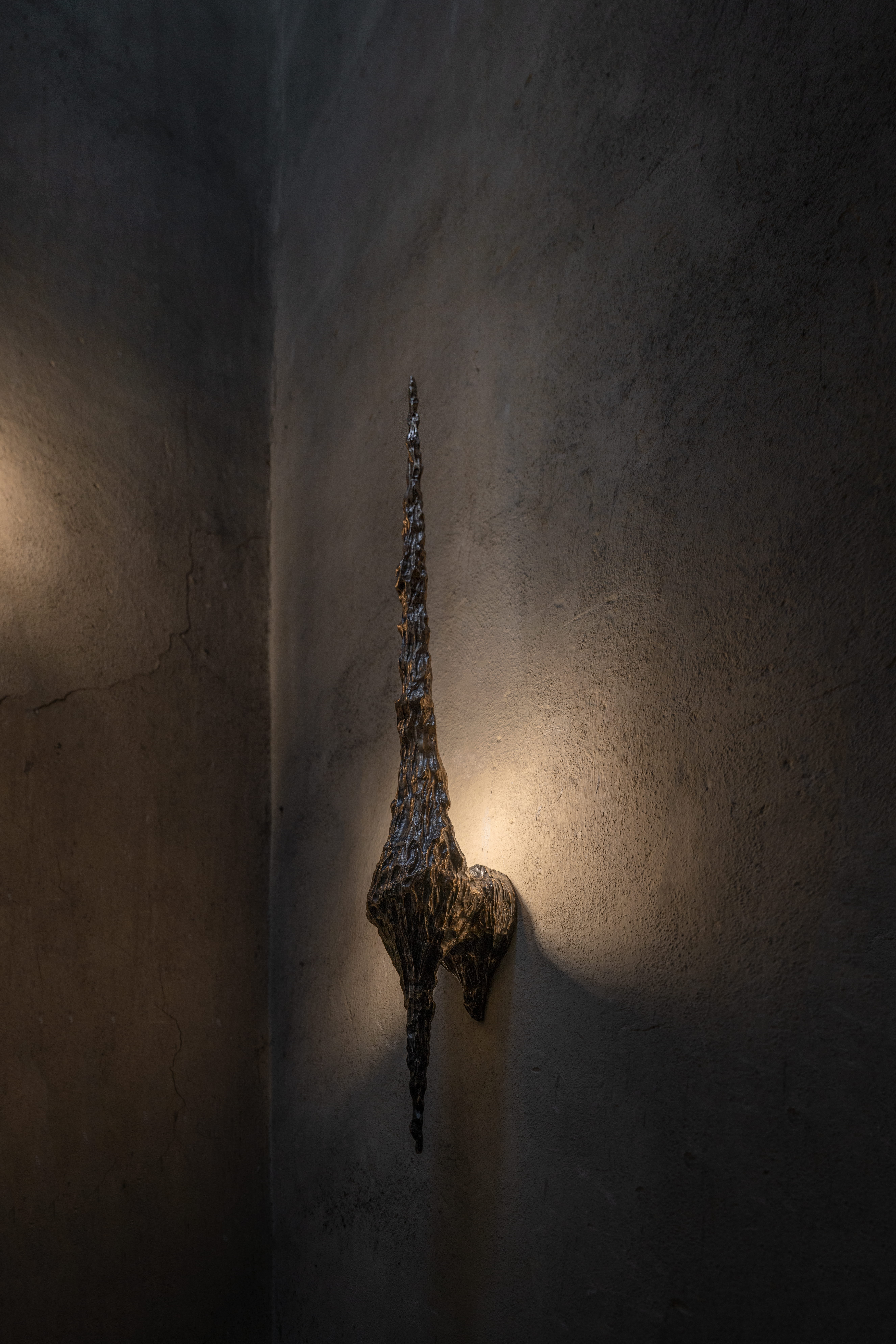 bronze bespoke lighting by William Guillon, dark picture, brutalist design 